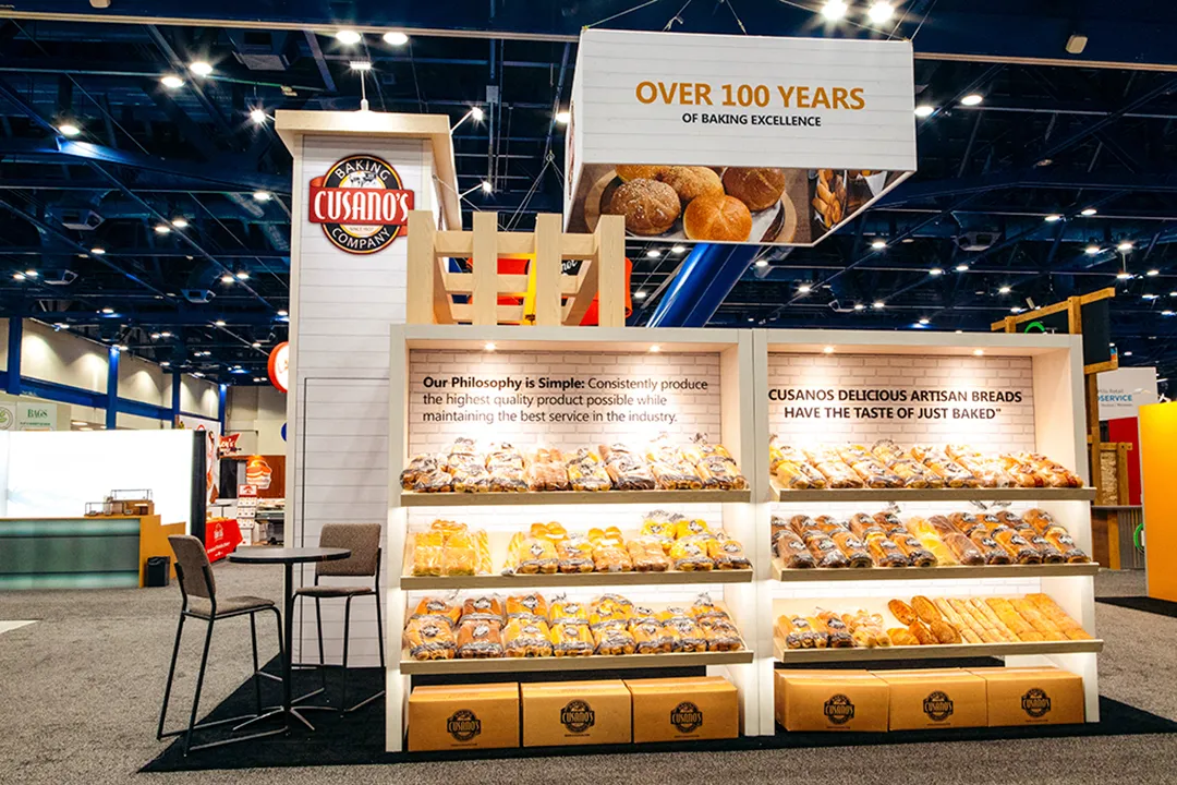 Front of the Cusano’s booth with backlit bread shelving