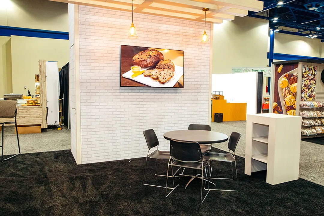 Cusano’s meeting area with a café table and product graphic
