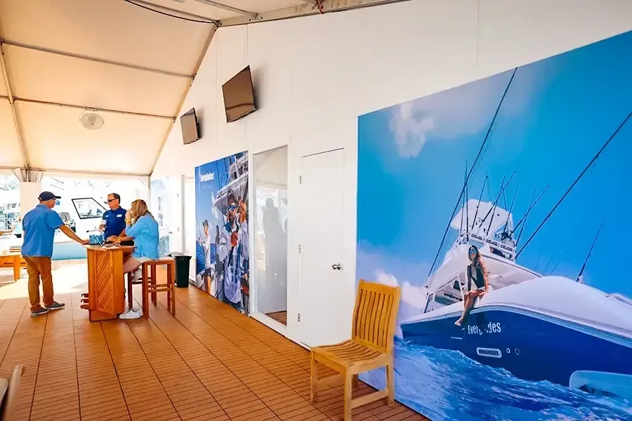 Interior of the Everglades booth with large boat images on the walls