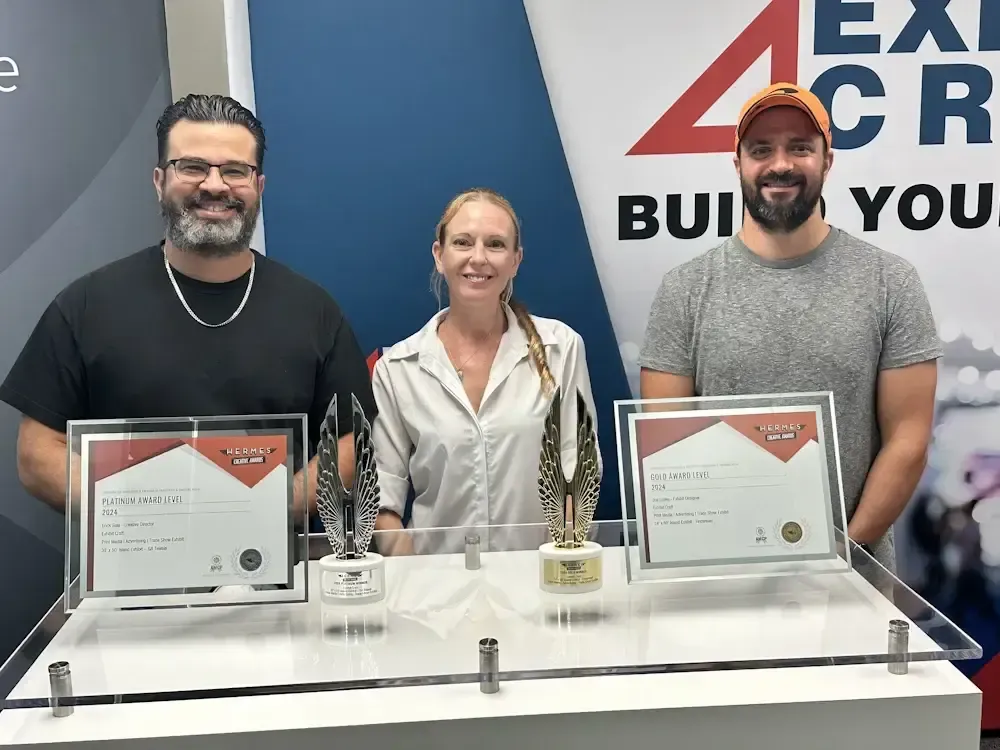 Exhibit Craft team with the Hermes Creative Awards trophies