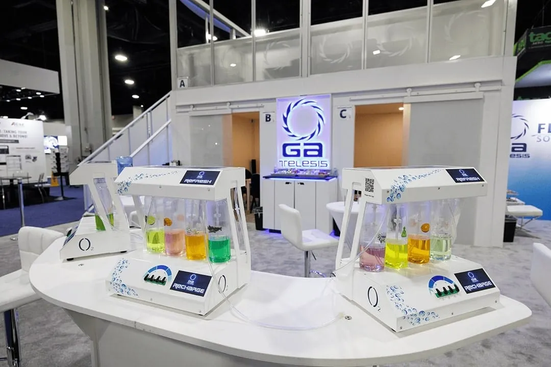 Oxygen bar with colored flavor dispensers at the GA Telesis exhibit