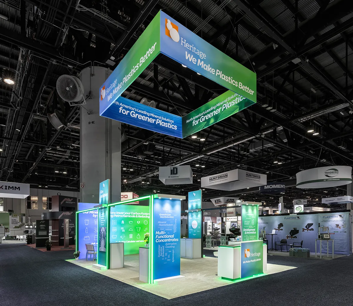 Square overhead sign suspended above the Heritage Plastics booth
