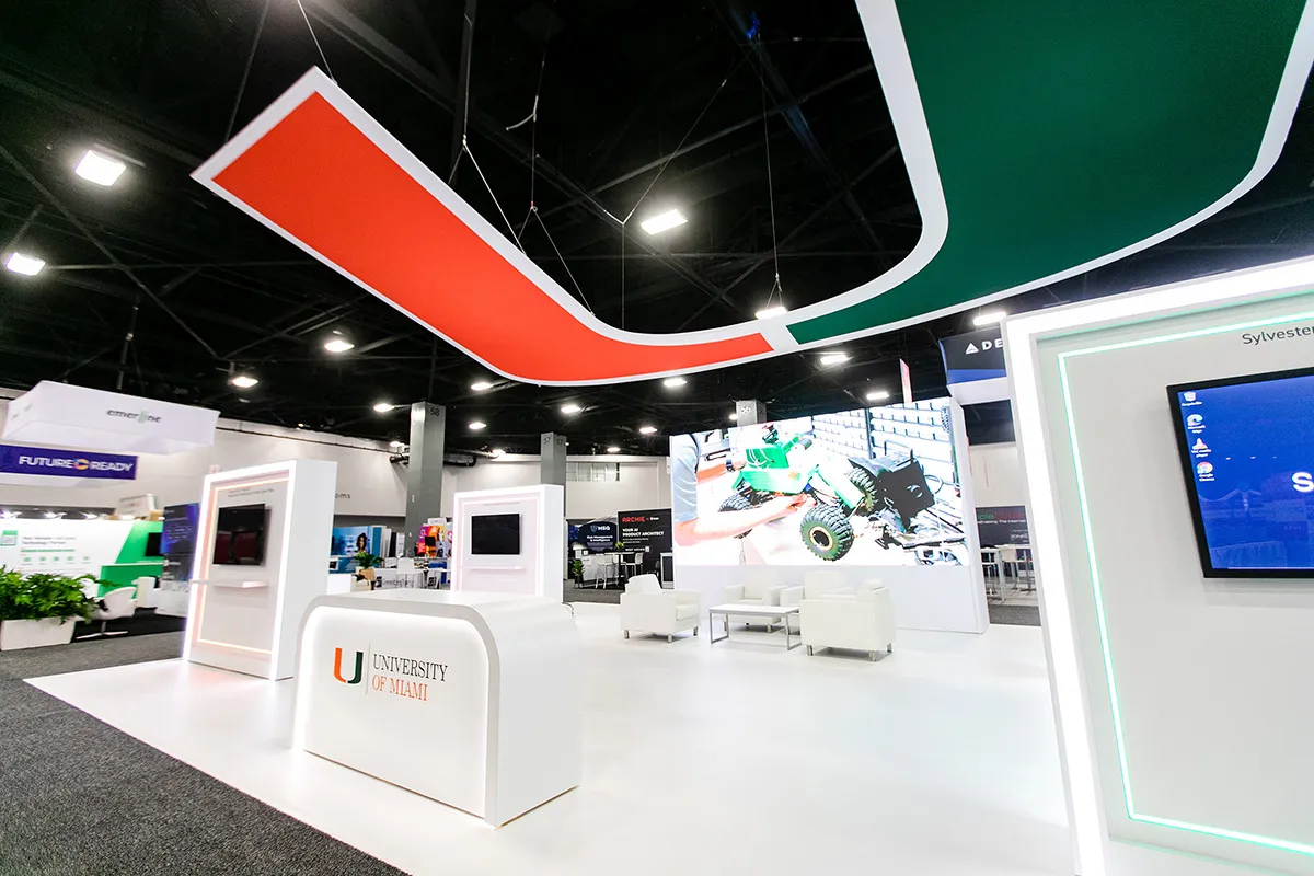 White University of Miami kiosks under the suspended U structure