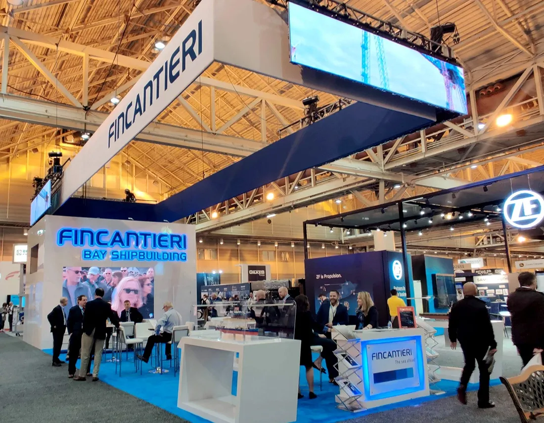 Fincantieri custom trade show exhibit with signage and attendees