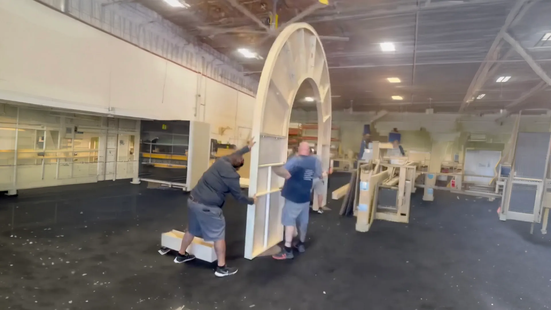 Exhibit Craft crew installing a booth arch on the show floor during move-in