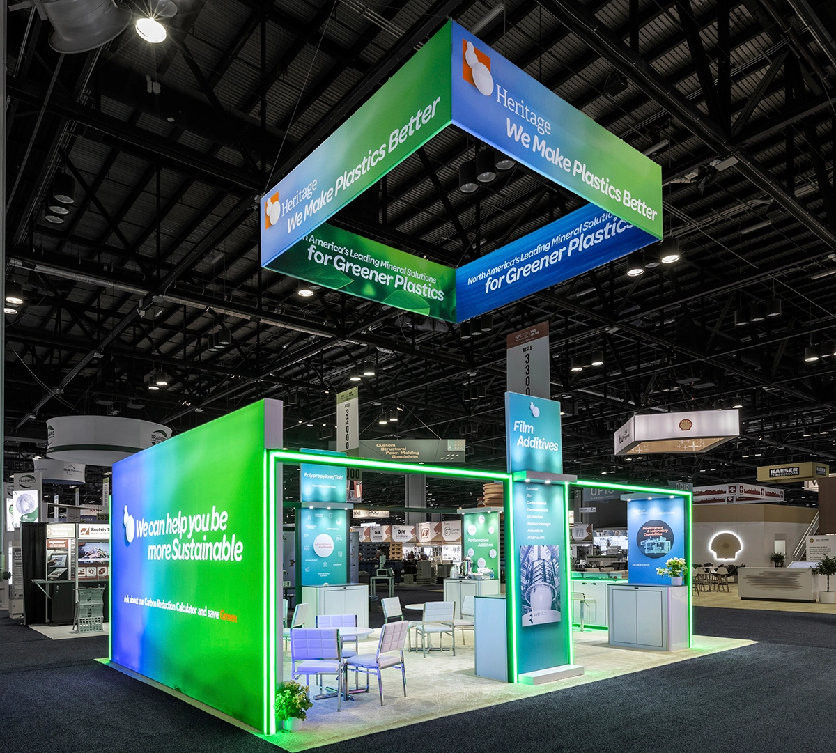 A vibrant 20 x 30 Trade Show Booth with green and blue lighting.