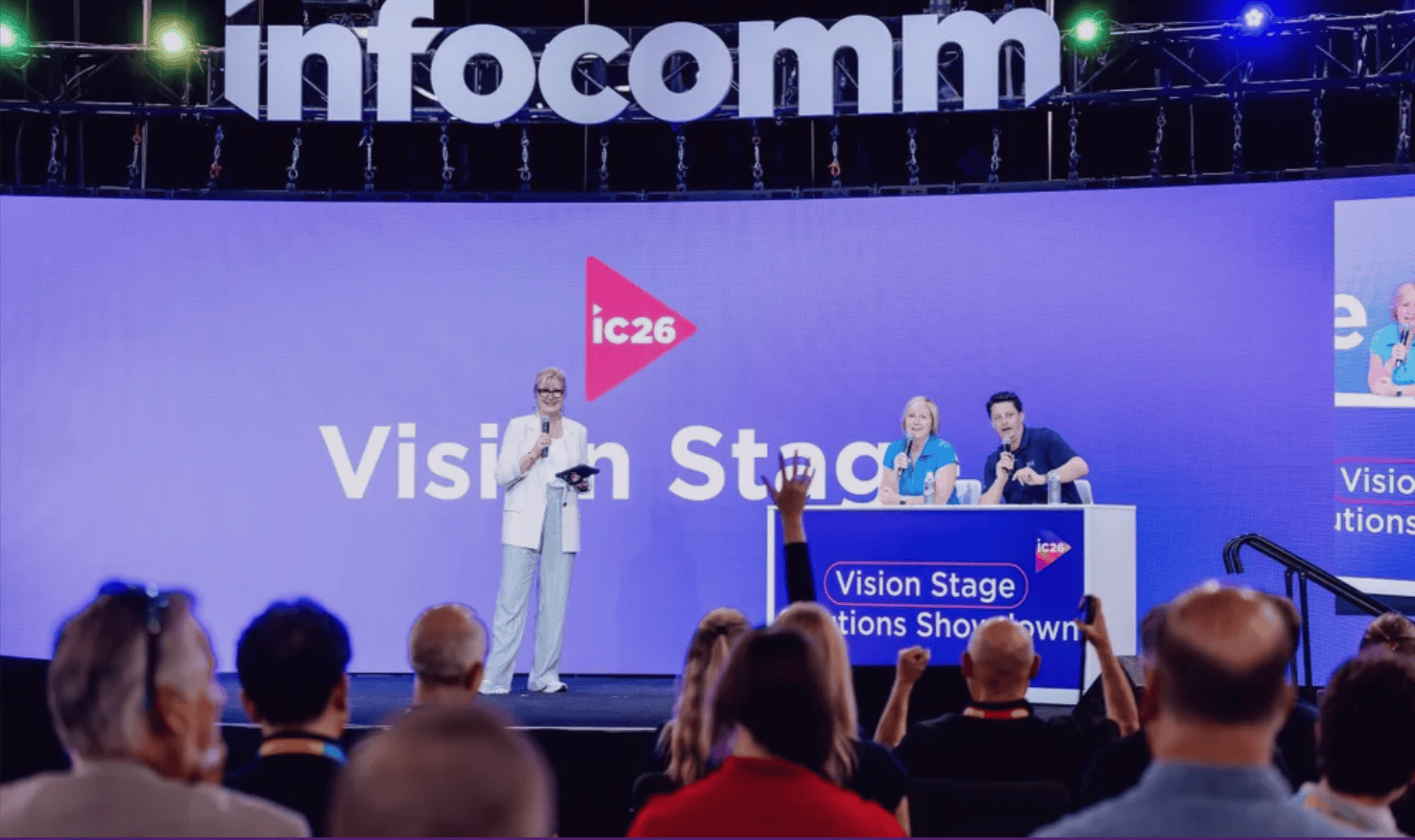 Presenters speak to an audience at the InfoComm 2026 Vision Stage.